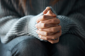 Stress, anxiety and hands of scared person with worry, fear or abuse in closeup, home or danger....