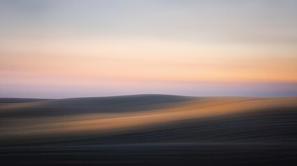 Obraz premium Serene Sunset Over Rolling Hills: A Study in Abstract Landscape Photography