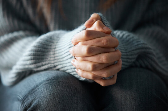 Stress, anxiety and hands of scared person with worry, fear or abuse in closeup, home or danger. Depression, lonely and insecure victim with phobia, mistake or crisis with nervous gesture or trauma