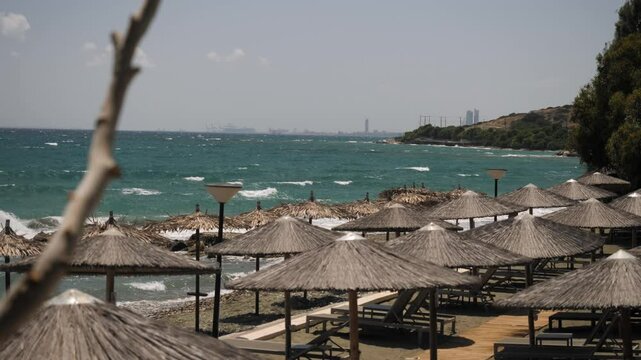 A beautiful Sunny Beach adorned with Palapas alongside stunning Turquoise Waters awaits you