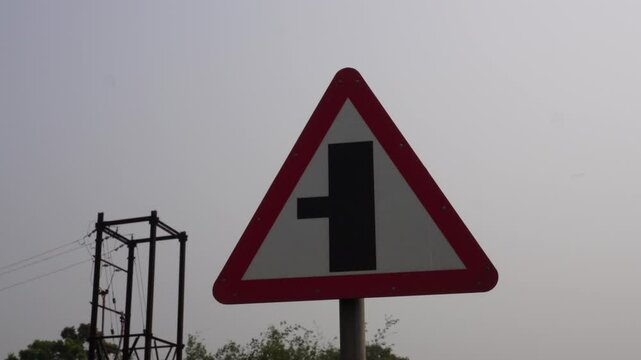 A Three-Way Junction warning sign commonly used in India which alerts drivers to an upcoming intersection where a side road joins from the left
