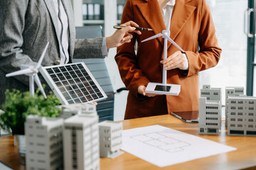Business team people planning hand using laptop for working technology and business Net zero and...