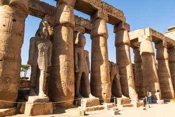 Karnak, Luxor, Egypt - 9 February 2022: Tourists and Columns at the Karnak Temple complex in Luxor