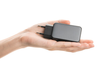 Black phone AC charger and USB cable on white background.	
