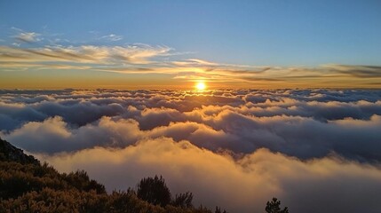 Golden sunlight cascades over billowing clouds, illuminating the tranquil landscape from a high vantage point. Nature's beauty unfolds in vibrant colors as day transitions to night