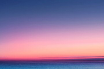 Fototapeta premium Beautiful sunset over tranquil ocean waters showcasing vibrant pink and purple hues during twilight