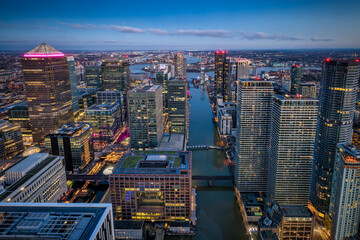 Fototapeta premium The office and residential skyscrapers at the financial district Canary Wharf, London, during evening