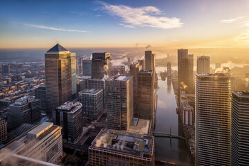 Panoramic sunrise view of the skyscrapers at the financial district Canary Wharf and the Docklands...