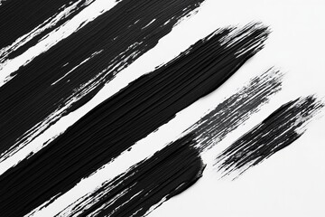Abstract expression of black paint strokes on white canvas creating depth and contrast in contemporary art