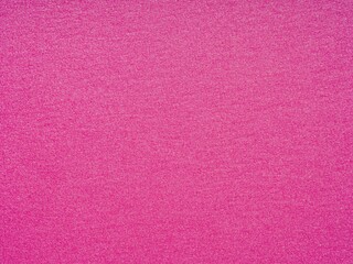 Fototapeta premium Vivid pink paper texture radiates with a sparkling, glittery surface, exuding a vibrant and playful vibe