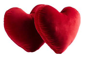 Two velvet heart-shaped pillows on white & transparent a background.