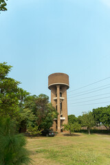 Fototapeta premium Explore the vintage water tower structure architecture in outdoor landscape