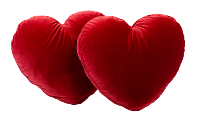 Two velvet heart-shaped pillows on white & transparent a background.