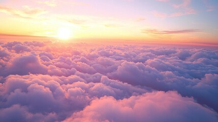 A breathtaking twilight unfolds as the sun sets, casting brilliant shades of pink and purple across a vast expanse of fluffy clouds, creating a serene and captivating atmosphere