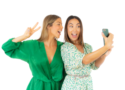 Two best friends smiling taking a selfie standing isolated over transparent background. PNG transparent.