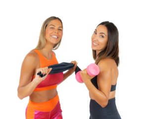 Two young sport women in the gym standing isolated over transparent background. PNG transparent.