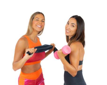 Two young sport women in the gym standing isolated over transparent background. PNG transparent.