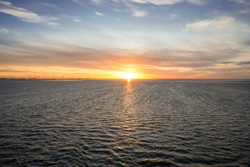 Landscape near Dagebüll. Nature with sunrise on the North Sea coast. Rising sun on the sea.
