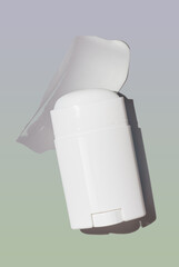 Cosmetic product solid deo-stick with swatch sample stroke on multicolored gradient background