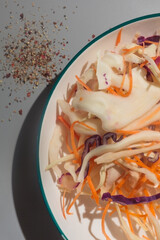 Cole slaw salad portion without dressing no mayo with ground pepper