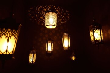Warm Light from Ornate Hanging Lanterns at Night