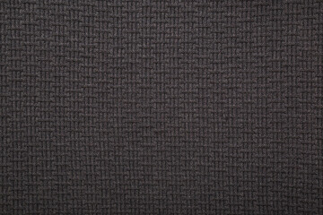 Dark black soft knitted fabric background. Empty place for text. Closeup. Top down view.