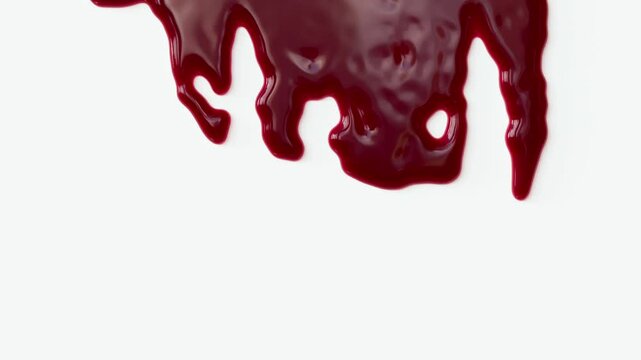 Halloween spooky blood dripping on white background with luma matte.