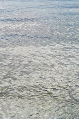 Tranquil surface of the Adriatic Sea reflecting the soft light of an overcast sky