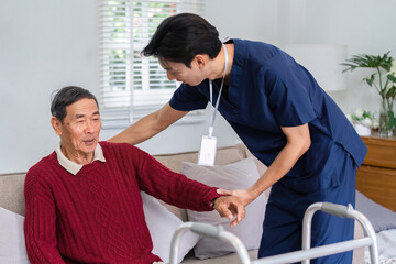 Friendly nurse assisting elderly man during a home care visit, providing comfort and support