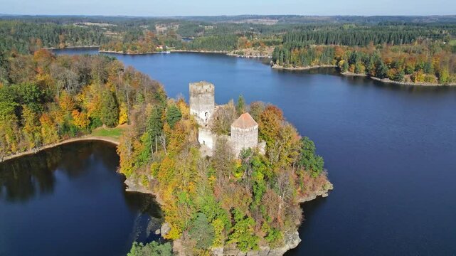 Aerial view of serene Stausee Ottenstein with a picturesque castle ruin and autumn foliage, Zwettl, Austria.