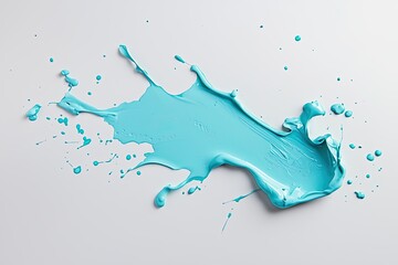 Obraz premium A vibrant splash of blue paint on a white background, showcasing texture and motion, ideal for artistic or creative themes.