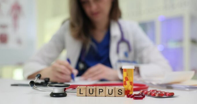 A focused view on lupus awareness, showcasing a professional assessing relevant materials and resources
