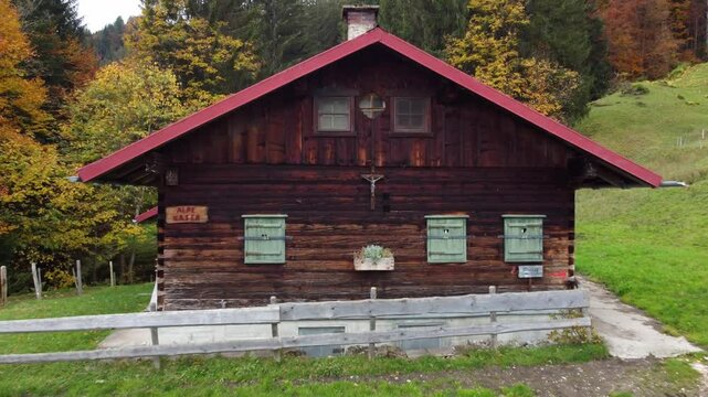 Christian crucifix hanging on a small shed in the Bavarian alps in Bavaria, Germany.