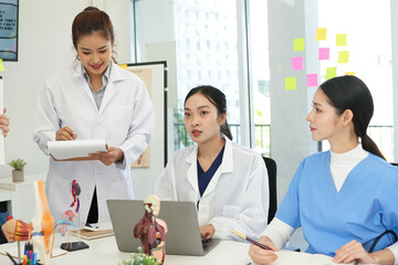 Fototapeta premium Male and female doctors are having a meeting in a hospital room.