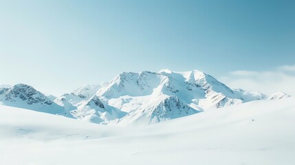 A snow-capped mountain range under a clear blue sky, a breathtaking view of a winter wonderland.