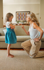 Discipline, pointing or scolding with mother and daughter in living room of home for lesson. Angry,...