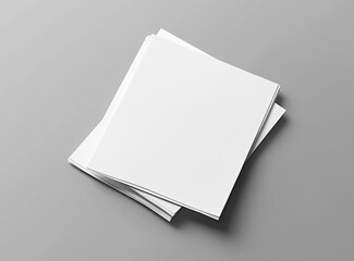 A mockup of two blank white A4 papers with shadows on a grey background, top view, flat lay, high resolution, high detail. 