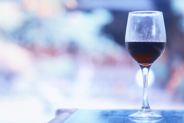 A glass of red wine is a beautiful background for serving