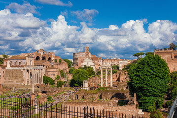 Fototapeta premium Roman Forum ancient ruins with Coliseum and Palatine Hill panoramic terrace from Capitoline Hill, in the very center of Rome