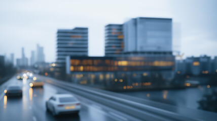 Obraz premium Rainy Cityscape at Dusk: A blurred, impressionistic view of a modern cityscape at dusk, rain falling on a busy highway with sleek modern buildings in the background.