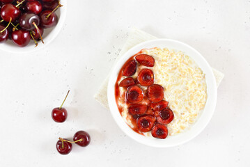 Oatmeal porridge with cherry slices