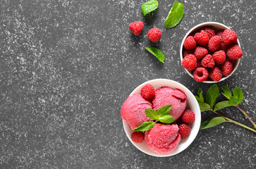 Raspberry ice cream scoop with fresh raspberries and fresh berry in bowl © nadin333