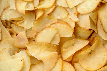 texture and background of crispy and tasty cassava chips close up