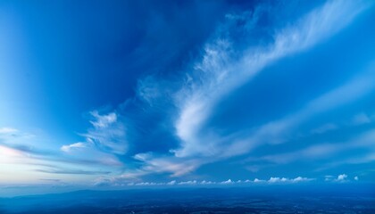 Obraz premium vibrant blue clouds swirling against a soft gradient backdrop evoking a sense of serenity and natures beauty perfect for weatherthemed designs