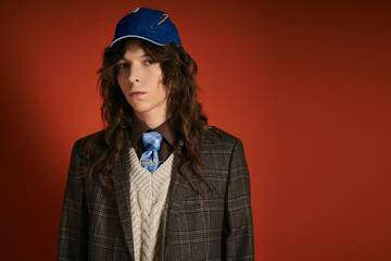 Handsome young man showcases trendy fashion in a bold setting with striking color contrasts