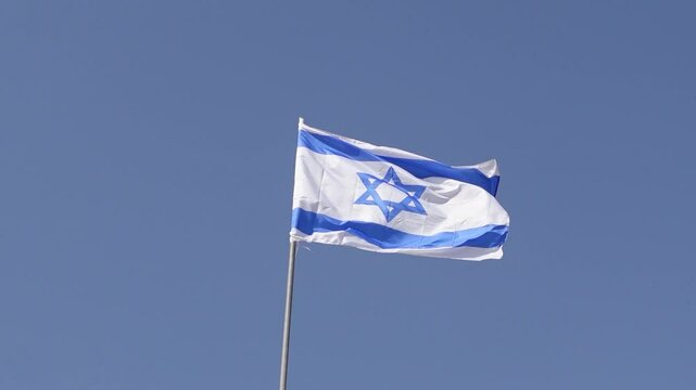 The Israeli flag waves proudly in Israel a symbol of unity.
