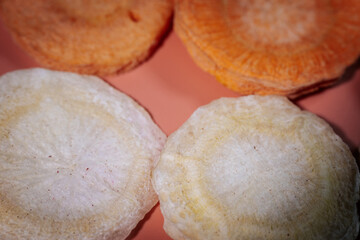 A macro shot of freeze-dried slices showcasing their deep, colorful hues, crunchy texture, and...