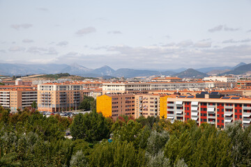Urban landscape of Pamplona with mountains in background, Spain
