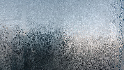 water drops on glass surface close up