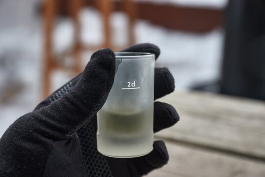 Drinking alcoholic spirit beverage in cold winter